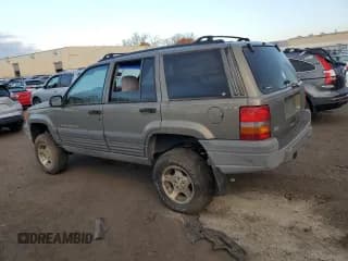 ✅ 1997 Jeep Grand Cherokee Laredo • VIN: 1J4GZ58S1VC741586 • Лот: 77619394. Опубликован ранее на Copart с пробегом Не указан. Бесплатный доступ к архиву аукционных продаж из США и подробный отчёт об истории автомобиля на DreamBid. Изображение 2.