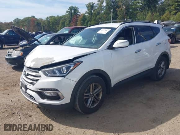 2018 Hyundai Santa Fe 2.4L z VIN 5NMZUDLB6JH078395, wystawiony jako IAAI lot #43277067 z przebiegiem 82 038 mil mil oraz . Historia ofert i sprzedaży dostępna na DreamBid. Obrazek 2.