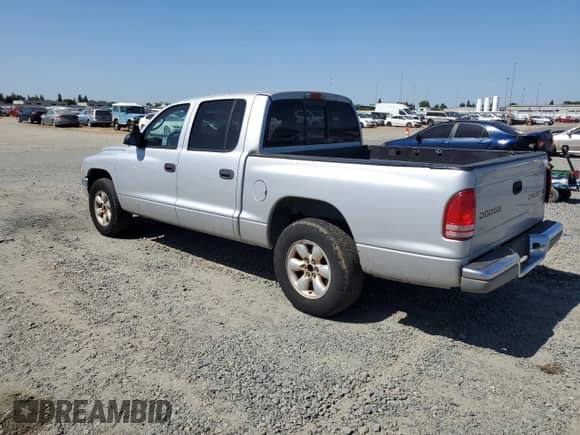 2004 Dodge Dakota SLT with VIN 1D7HL48K44S780575, listed as a Copart auction lot 57872335 with 148,785 mi miles and Salvage title. Bid and sale history available at DreamBid. Image 2.