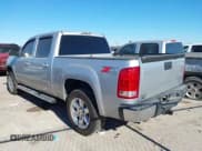 ✅ 2013 GMC Sierra 1500 SLT • VIN: 3GTP2WE78DG323280 • Lot: 41148621. Listed on IAAI with 143,491 mi. Free auction sales archive from the USA and detailed vehicle history report at DreamBid. Image 3.