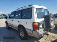 ✅ 1995 Mitsubishi Montero • VIN: JA4MR41H3SJ004800 • Lot: 72036354. Listed on Copart with 209,635 mi. Free auction sales archive from the USA and detailed vehicle history report at DreamBid. Image 2.