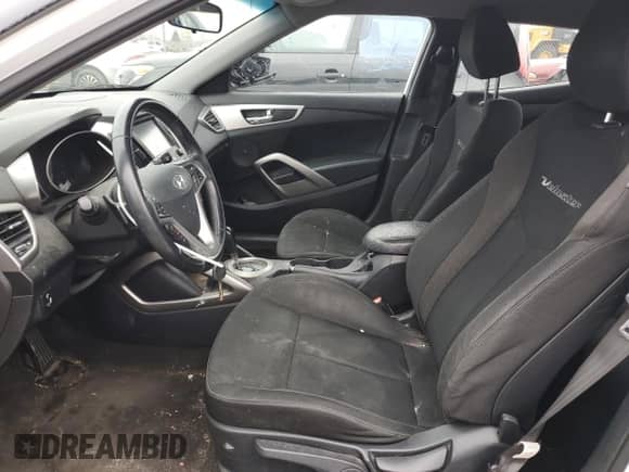 2017 Hyundai Veloster z VIN KMHTC6AD8HU310860, wystawiony jako Copart lot #42170923 z przebiegiem 97 009 mil mil oraz . Historia ofert i sprzedaży dostępna na DreamBid. Obrazek 7.