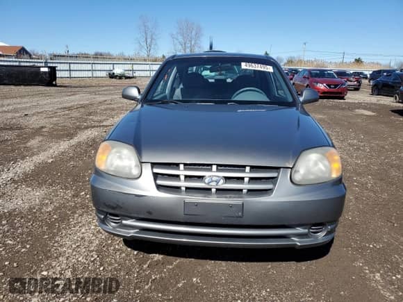 2005 Hyundai Accent GLS с VIN KMHCG35C65U331867, выставлен на аукционе Copart как лот 49637495 с пробегом 63 901 миль миль и Чистый • Clean title. История ставок и продаж доступна на DreamBid. Изображение 5.