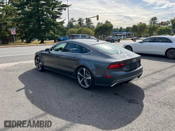 ✅ 2016 Audi RS 7 Prestige • VIN: WUAW2BFC5GN902306 • Лот: 92946995. Опубликован ранее на Copart с пробегом 83 064 миль. Бесплатный доступ к архиву аукционных продаж из США и подробный отчёт об истории автомобиля на DreamBid. Изображение 4.