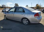 ✅ 2009 Kia Spectra LX • VIN: KNAFE221295605504 • Lot: 92089535. Listed on Copart with 150,112 mi. Free auction sales archive from the USA and detailed vehicle history report at DreamBid. Image 2.