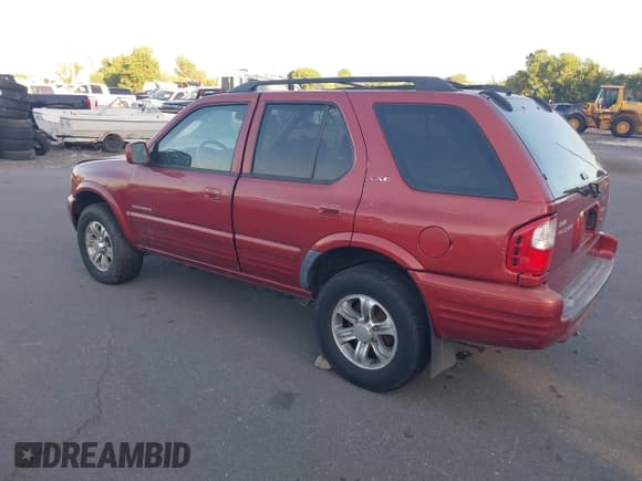 ✅ 2001 Isuzu Rodeo S • VIN: 4S2CK58W414308980 • Lot: 42496432. Listed on IAAI with 166,360 mi. Free auction sales archive from the USA and detailed vehicle history report at DreamBid. Image 3.