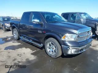 ✅ 2015 Ram 1500 Laramie • VIN: 1C6RR7NM6FS666544 • Lot: 43166718. Listed on IAAI with 192,927 mi. Free auction sales archive from the USA and detailed vehicle history report at DreamBid. Image 1.