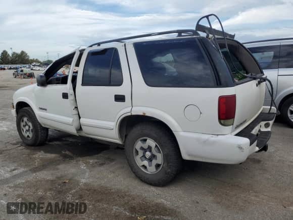 2004 Chevrolet Blazer LS z VIN 1GNDT13X84K162371, wystawiony jako Copart lot #71074684 z przebiegiem 273 070 mil mil oraz Szkoda całkowita • Salvage title. Historia ofert i sprzedaży dostępna na DreamBid. Obrazek 2.