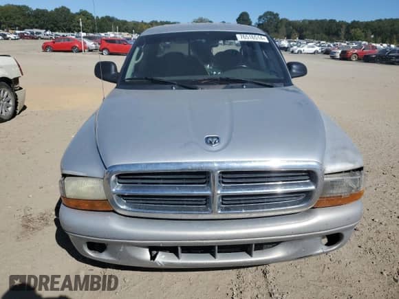 2003 Dodge Dakota SLT z VIN 1D7HL48X33S340079, wystawiony jako Copart lot #76516514 z przebiegiem 295 350 mil mil oraz Czysty tytuł • Clean title. Historia ofert i sprzedaży dostępna na DreamBid. Obrazek 5.