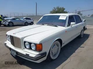 ✅ 1990 Bentley Turbo R • VIN: SCBZR03DXLCX32699 • Lot: 42960582. Wystawiony na IAAI z przebiegiem 38 147 mil. Bezpłatny archiwum sprzedaży aukcyjnych z USA i szczegółowy raport historii pojazdu na DreamBid. Zdjęcie 2.