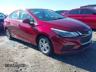 ✅ 2018 Chevrolet Cruze LT • VIN: 1G1BE5SM1J7213855 • Lot: 40998816. Listed on IAAI with 84,328 mi. Free auction sales archive from the USA and detailed vehicle history report at DreamBid. Image 1.