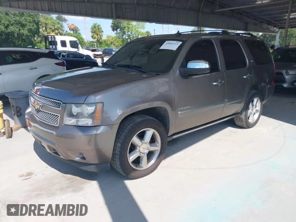 ✅ 2011 Chevrolet Tahoe LTZ • VIN: 1GNSCCE09BR333023 • Lot: 43085215. Listed on IAAI with 165,616 mi. Free auction sales archive from the USA and detailed vehicle history report at DreamBid. Image 2.