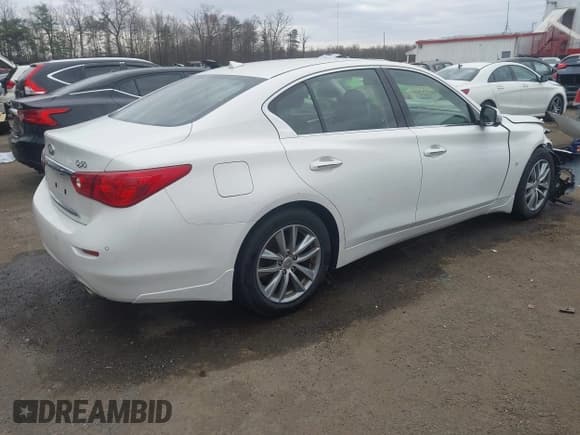 ✅ 2014 Infiniti Q50 Premium • VIN: JN1BV7AR7EM692504 • Lot: 43789438. Listed on IAAI with 104,772 mi. Free auction sales archive from the USA and detailed vehicle history report at DreamBid. Image 4.