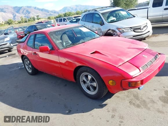 ✅ 1987 Porsche 924 • VIN: WP0AA092XHN452123 • Lot: 43422806. Wystawiony na IAAI z przebiegiem 51 923 mil. Bezpłatny archiwum sprzedaży aukcyjnych z USA i szczegółowy raport historii pojazdu na DreamBid. Zdjęcie 1.