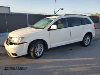 2015 Dodge Journey SXT z VIN 3C4PDCBG2FT610363, wystawiony jako Copart lot #86847885 z przebiegiem 128 271 mil mil oraz Szkoda całkowita • Salvage title. Historia ofert i sprzedaży dostępna na DreamBid. Obrazek 1.