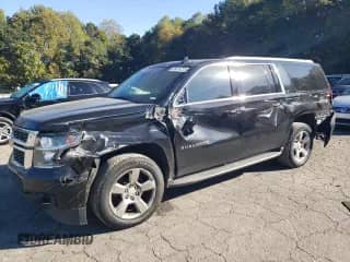 2019 Chevrolet Suburban LT with VIN 1GNSCHKC9KR133853, listed as a Copart auction lot 85876225 with 157,585 mi miles and Salvage title. Bid and sale history available at DreamBid. Image 1.