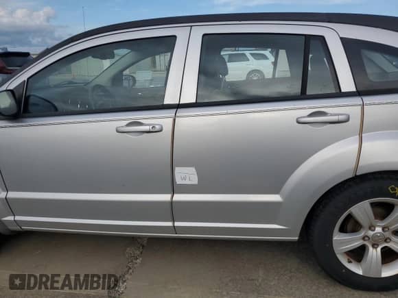 2012 Dodge Caliber SXT z VIN 1C3CDWDA5CD533597, wystawiony jako Copart lot #73834484 z przebiegiem 94 908 mil mil oraz Szkoda całkowita • Salvage title. Historia ofert i sprzedaży dostępna na DreamBid. Obrazek 13.