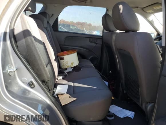 ✅ 2009 Kia Sportage LX • VIN: KNDJF724697632887 • Лот: 91327385. Опубликован ранее на Copart с пробегом Не указан. Бесплатный доступ к архиву аукционных продаж из США и подробный отчёт об истории автомобиля на DreamBid. Изображение 11.