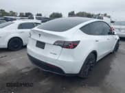 ✅ 2023 Tesla Model Y Long Range • VIN: 7SAYGDEE3PA055497 • Lot: 42396529. Listed on IAAI with 18,230 mi. Free auction sales archive from the USA and detailed vehicle history report at DreamBid. Image 4.