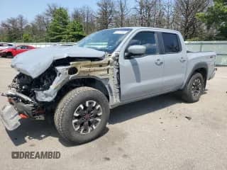 2022 Nissan Frontier Pro-4X with VIN 1N6ED1EK6NN625388, listed as a Copart auction lot 65273395 with 24,244 mi miles and Salvage title. Bid and sale history available at DreamBid. Image 1.