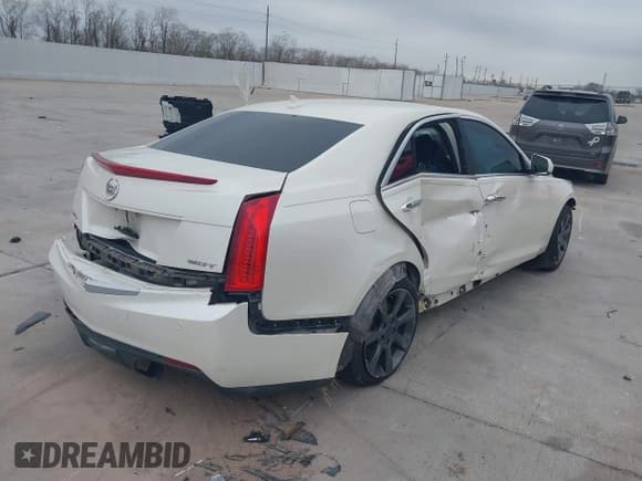 ✅ 2013 Cadillac ATS • VIN: 1G6AG5RX3D0138802 • Lot: 41192671. Listed on IAAI with 77,130 mi. Free auction sales archive from the USA and detailed vehicle history report at DreamBid. Image 4.