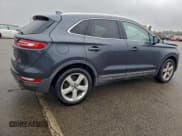 ✅ 2015 Lincoln MKC • VIN: 5LMCJ1A92FUJ17876 • Lot: 94589955. Listed on Copart with 188,688 mi. Free auction sales archive from the USA and detailed vehicle history report at DreamBid. Image 3.