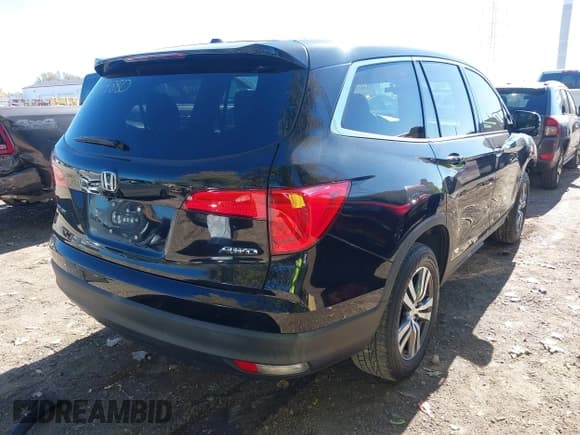 ✅ 2016 Honda Pilot EX-L • VIN: 5FNYF6H70GB037163 • Lot: 43499880. Listed on IAAI with 245,011 mi. Free auction sales archive from the USA and detailed vehicle history report at DreamBid. Image 4.
