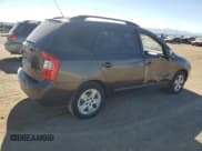 ✅ 2009 Kia Rondo LX • VIN: KNAFG528897244535 • Лот: 89663925. Опубликован ранее на Copart с пробегом 209 902 миль. Бесплатный доступ к архиву аукционных продаж из США и подробный отчёт об истории автомобиля на DreamBid. Изображение 3.