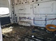 ✅ 2015 Nissan NV S • VIN: 1N6BF0LX8FN807035 • Lot: 63243345. Wystawiony na Copart z przebiegiem 188 536 mil. Bezpłatny archiwum sprzedaży aukcyjnych z USA i szczegółowy raport historii pojazdu na DreamBid. Zdjęcie 11.