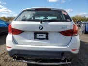 ✅ 2014 BMW X1 xDrive28i • VIN: WBAVL1C59EVY11197 • Лот: 89719415. Опубликован ранее на Copart с пробегом 86 467 миль. Бесплатный доступ к архиву аукционных продаж из США и подробный отчёт об истории автомобиля на DreamBid. Изображение 6.