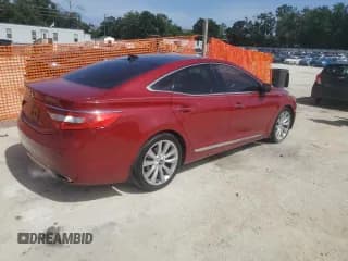 ✅ 2013 Hyundai Azera • VIN: KMHFH4JG8DA330003 • Лот: 66338915. Опубликован ранее на Copart с пробегом 141 010 миль. Бесплатный доступ к архиву аукционных продаж из США и подробный отчёт об истории автомобиля на DreamBid. Изображение 3.