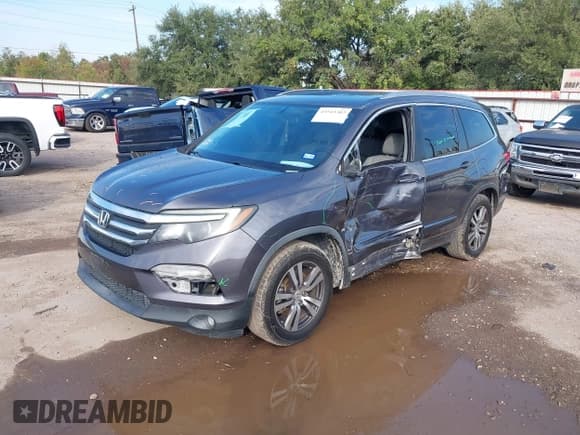 ✅ 2018 Honda Pilot EX-L • VIN: 5FNYF5H59JB027960 • Lot: 43543303. Listed on IAAI with 157,573 mi. Free auction sales archive from the USA and detailed vehicle history report at DreamBid. Image 18.