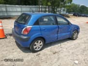 ✅ 2009 Kia Rio LX • VIN: KNADE243596517255 • Лот: 63750795. Опубликован ранее на Copart с пробегом 38 563 миль. Бесплатный доступ к архиву аукционных продаж из США и подробный отчёт об истории автомобиля на DreamBid. Изображение 3.