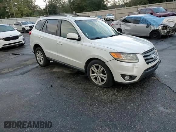 ✅ 2012 Hyundai Santa Fe SE • VIN: 5XYZH4AG2CG097607 • Lot: 79174504. Listed on Copart with 120,830 mi. Free auction sales archive from the USA and detailed vehicle history report at DreamBid. Image 12.