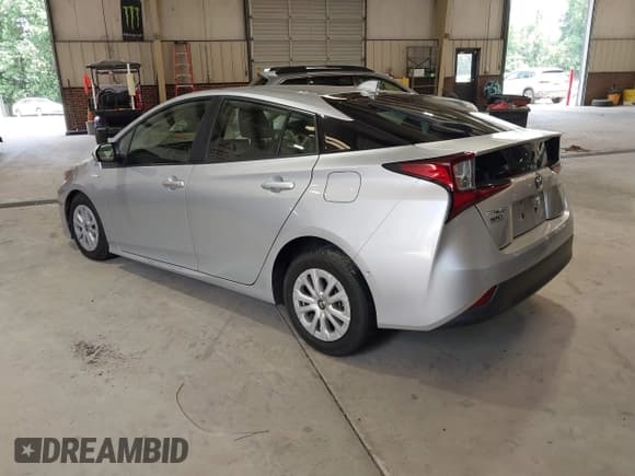 ✅ 2021 Toyota Prius L Eco • VIN: JTDKAMFUXM3144568 • Lot: 42689815. Listed on IAAI with 78,721 mi. Free auction sales archive from the USA and detailed vehicle history report at DreamBid. Image 3.