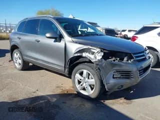 ✅ 2012 Volkswagen Touareg Sport • VIN: WVGEK9BP2CD008530 • Lot: 43882545. Listed on IAAI with 157,175 mi. Free auction sales archive from the USA and detailed vehicle history report at DreamBid. Image 1.