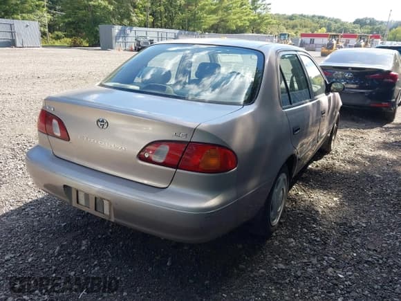 ✅ 1999 Toyota Corolla VE • VIN: 2T1BR12E1XC141396 • Lot: 42969365. Listed on IAAI with 215,831 mi. Free auction sales archive from the USA and detailed vehicle history report at DreamBid. Image 4.