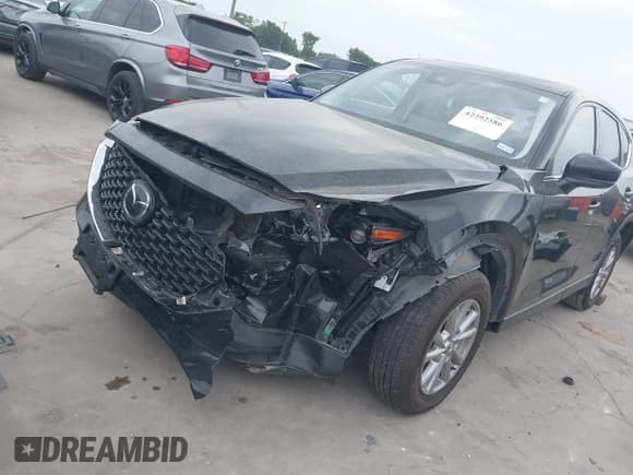 ✅ 2023 Mazda CX-5 S Carbon Edition • VIN: JM3KFBCM8P0202054 • Lot: 42392586. Listed on IAAI with 50,944 mi. Free auction sales archive from the USA and detailed vehicle history report at DreamBid. Image 2.