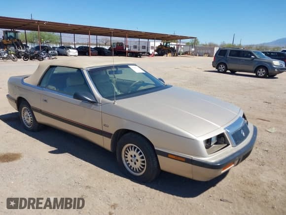 ✅ 1992 Chrysler LeBaron • VIN: 1C3XU4532NF283782 • Lot: 41841326. Listed on IAAI with 99,528 mi. Free auction sales archive from the USA and detailed vehicle history report at DreamBid. Image 1.