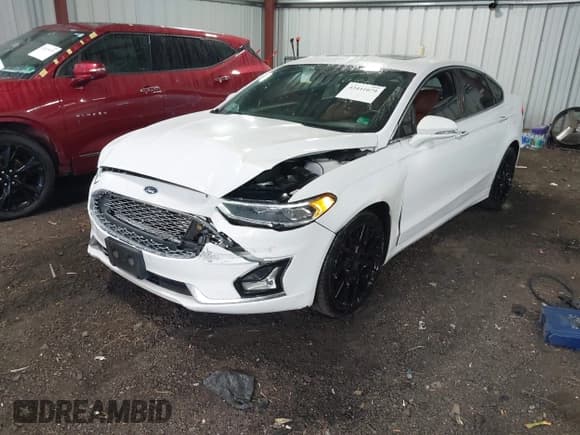 ✅ 2020 Ford Fusion Titanium • VIN: 3FA6P0D9XLR137939 • Lot: 43441079. Listed on IAAI with 80,627 mi. Free auction sales archive from the USA and detailed vehicle history report at DreamBid. Image 2.