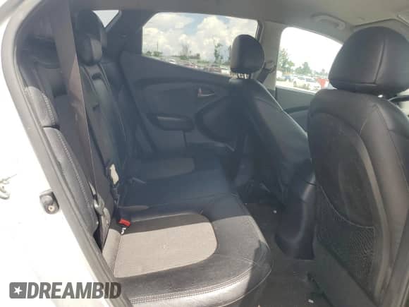 2013 Hyundai Tucson GLS z VIN KM8JU3AC4DU574811, wystawiony jako Copart lot #69299034 z przebiegiem 149 591 mil mil oraz Szkoda całkowita • Salvage title. Historia ofert i sprzedaży dostępna na DreamBid. Obrazek 11.