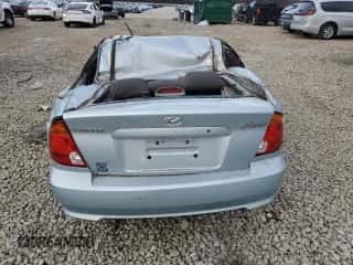 2004 Hyundai Accent GL with VIN KMHCG35C24U302719, listed as a Copart auction lot 86543844 with 46,548 mi miles and Salvage title. Bid and sale history available at DreamBid. Image 6.