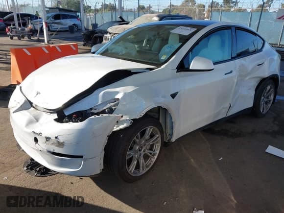 ✅ 2023 Tesla Model Y Long Range • VIN: 7SAYGDEE4PF620004 • Lot: 43634942. Listed on IAAI with 27,885 mi. Free auction sales archive from the USA and detailed vehicle history report at DreamBid. Image 16.