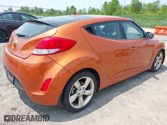 2012 Hyundai Veloster w/Gray Int z VIN KMHTC6AD0CU043402, wystawiony jako IAAI lot #42406321 z przebiegiem 116 734 mil mil oraz . Historia ofert i sprzedaży dostępna na DreamBid. Obrazek 4.