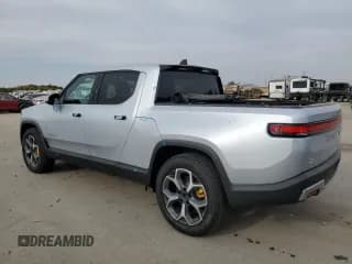 ✅ 2023 Rivian R1T Adventure • VIN: 7FCTGAAA6PN024557 • Lot: 75545024. Listed on Copart with 6,841 mi. Free auction sales archive from the USA and detailed vehicle history report at DreamBid. Image 2.