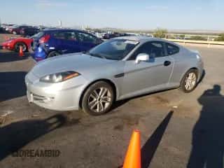 2008 Hyundai Tiburon GS с VIN KMHHM66D48U293082, выставлен на аукционе Copart как лот 64401385 с пробегом 71 163 миль миль и Списание • Salvage title. История ставок и продаж доступна на DreamBid. Изображение 1.