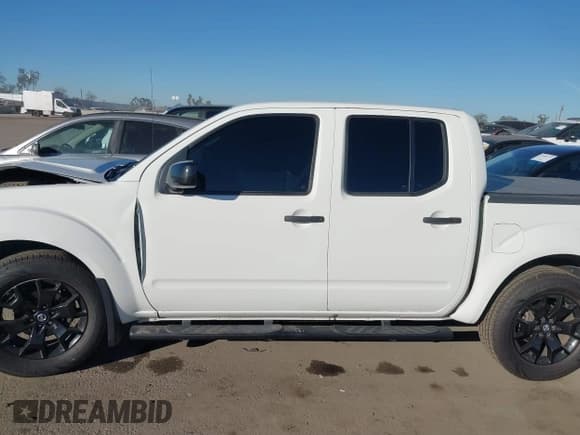 ✅ 2020 Nissan Frontier SV • VIN: 1N6ED0EA9LN728299 • Lot: 43657712. Listed on IAAI with 127,885 mi. Free auction sales archive from the USA and detailed vehicle history report at DreamBid. Image 14.