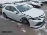 2022 Toyota Camry Hybrid XLE with VIN 4T1F31AK8NU575434, listed as a IAAI auction lot 41067498 with 11,052 mi miles and . Bid and sale history available at DreamBid. Image 1.