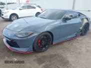 ✅ 2024 Nissan Z Nismo • VIN: JN1BZ4CH7RM360818 • Lot: 42733312. Listed on IAAI with 3,306 mi. Free auction sales archive from the USA and detailed vehicle history report at DreamBid. Image 2.