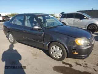 2005 Hyundai Accent GLS z VIN KMHCG45C05U665091, wystawiony jako Copart lot #87264075 z przebiegiem 179 141 mil mil oraz Szkoda całkowita • Salvage title. Historia ofert i sprzedaży dostępna na DreamBid. Obrazek 4.